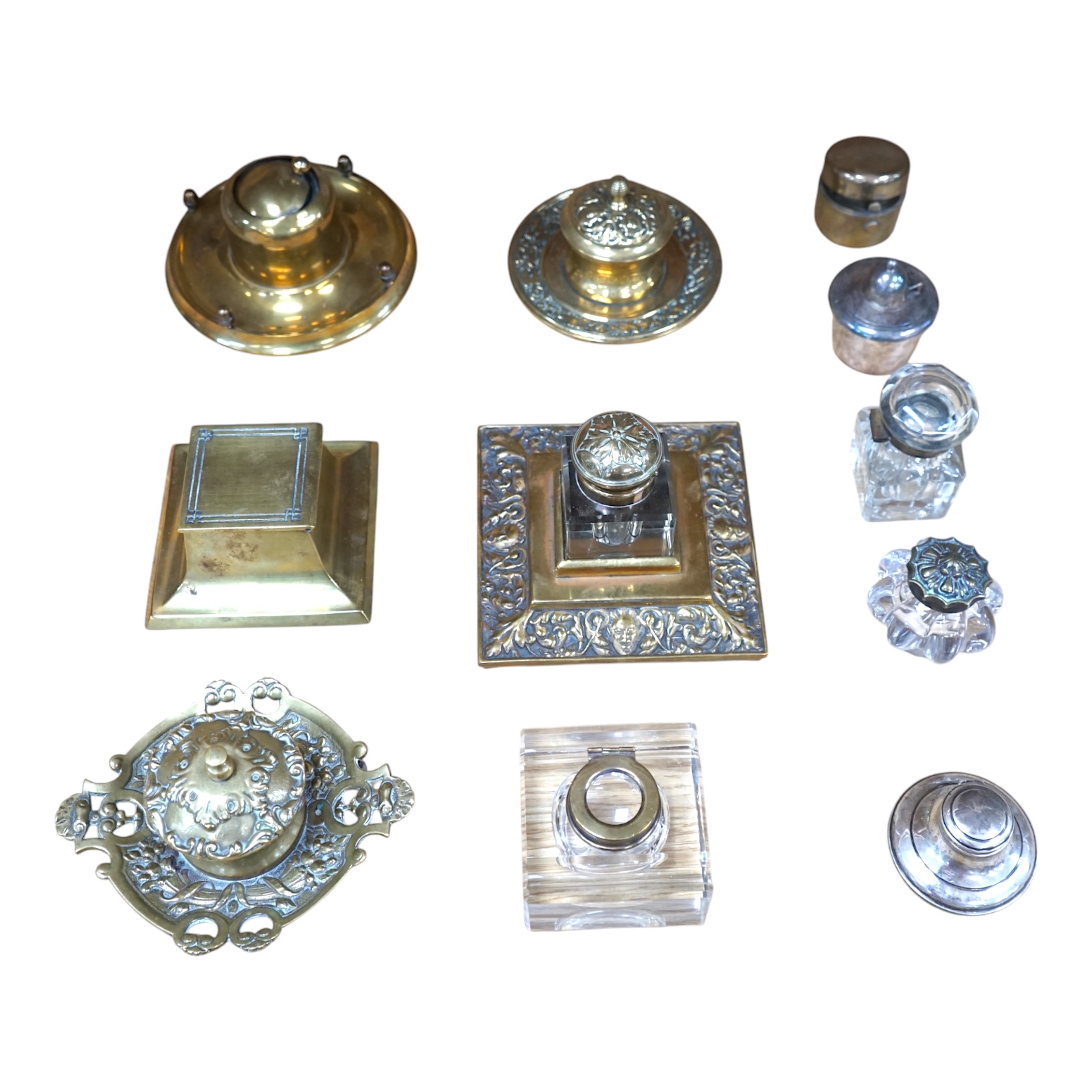 Eleven various 19th century and later inkwells, mostly brass. Condition varies